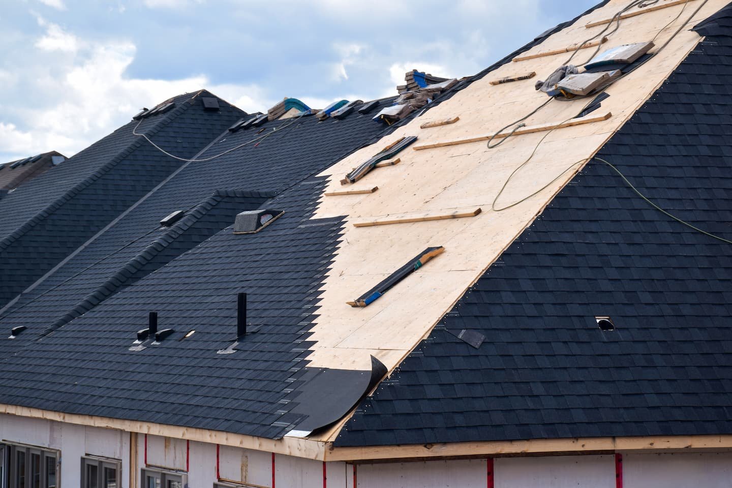 closeup-installation-of-black-roof-shingles-on-new-2026-03-24-08-40-34-utc.jpg