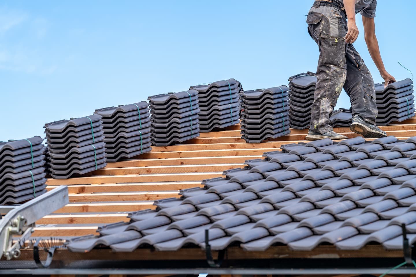 craftsman-laying-fired-ceramic-tiles-on-the-roof-2026-03-16-02-32-53-utc.jpg